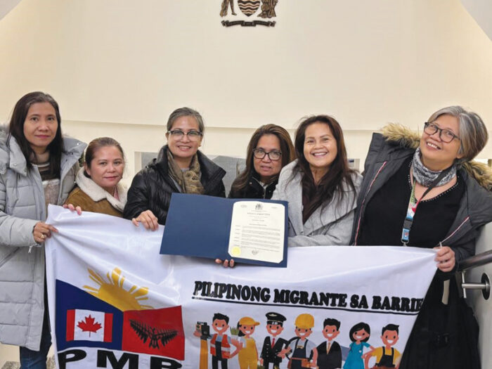 Members & Officers of the PMB holding the City Proclamation of IMD at the CIty Hall in Barrie, Dec 17. (Photo credit: PMB)