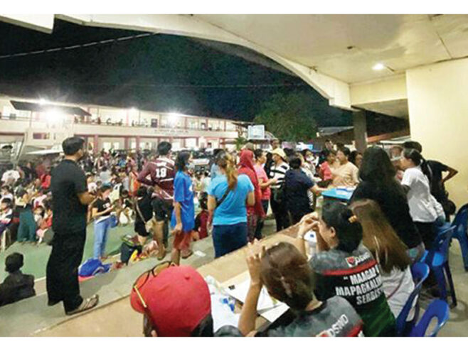 EVACUEES from upland areas in La Castellana, Negros Occidental stay at Saint Vincent's High School Inc. after Kanlaon Volcano erupted on Monday, Dec. 9. (Photo courtesy of Lumyen Castandiello)